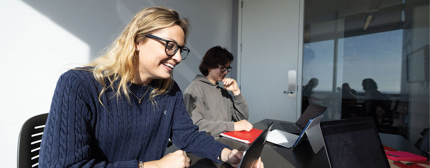 Two students collaborating in a study room